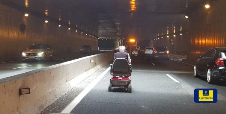 senior citizen takes mobility scooter on highway