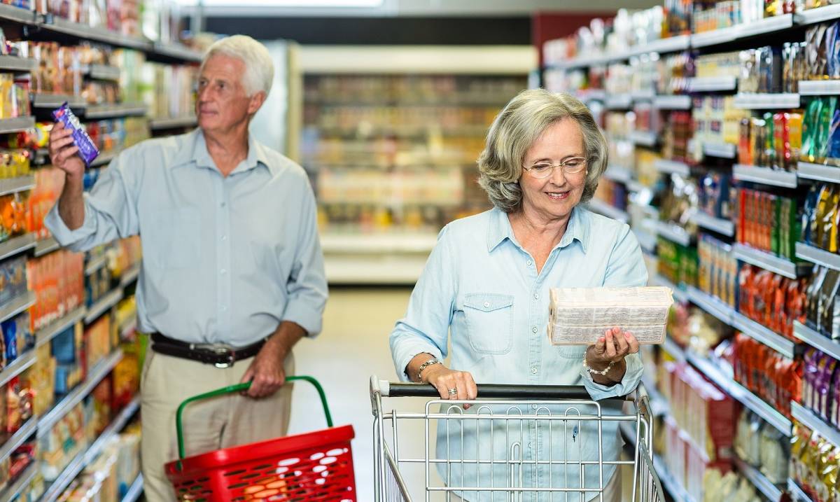 elderly couple shopping at bi mart, senior discount day for all seniors